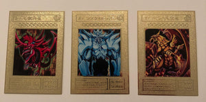 Yugioh Egyptian God Cards - the Winged Dragon of Ra, Obelisk the Tormentor, Slifer the Sky Dragon. These are gold metal cards of the original Egyptian God cards. They are regular card dimensions and around .3 oz per card.