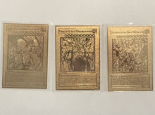 Load image into Gallery viewer, Yugioh Egyptian God Cards - the Winged Dragon of Ra, Obelisk the Tormentor, Slifer the Sky Dragon. These are gold metal cards of the original Egyptian God cards. They are regular card dimensions and around .3 oz per card.
